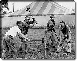 Driving Tent Spikes at the Fair